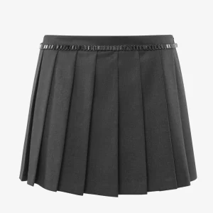 Gonna mini  in manolana a pieghe con applicazione gioiello